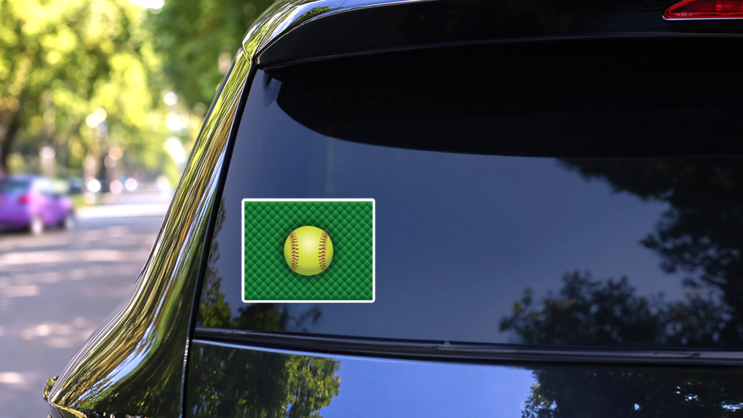 Softball On A Green Checkered Background Sticker on a Rear Car Window (New) example