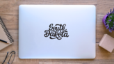 South Dakota Calligraphy Sticker on a Laptop (New) example