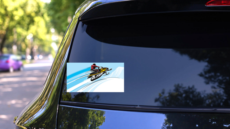 Speeding Snowmobile Cartoon Sticker on a Rear Car Window (New) example