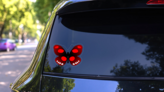 Spotted Red Butterfly Sticker on a Rear Car Window (New) example