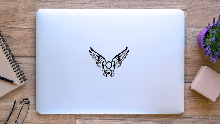 Spread Tribal Wings Sticker on a Laptop (New) example
