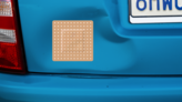 Square Band Aid Bandage Sticker on a Dented Car example