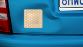 Square Band Aid Sticker on a Dented Car example