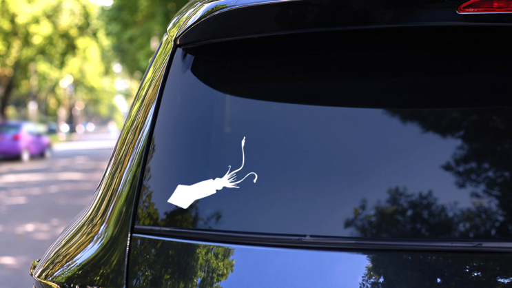 Squid Swimming Down Facing Left Sticker on a Rear Car Window (New) example