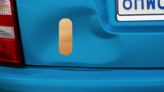 Standard Band Aid Sticker on a Dented Car example