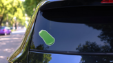 Stroke Of Green Nail Polish Sticker on a Rear Car Window (New) example