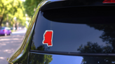 Stylized Red Sketch Map Of Mississippi Sticker on a Rear Car Window (New) example