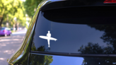 Surfer Sticker on a Rear Car Window (New) example