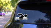 Swimming Cartoon Icon Sticker on a Rear Car Window (New) example