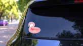 Swimming Ring In Shape Of Pink Flamingo Sticker on a Rear Car Window (New) example