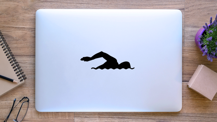 Swimming Silhouette Sticker on a Laptop (New) example