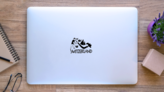 Symbols Of Switzerland Lettering Sticker on a Laptop (New) example