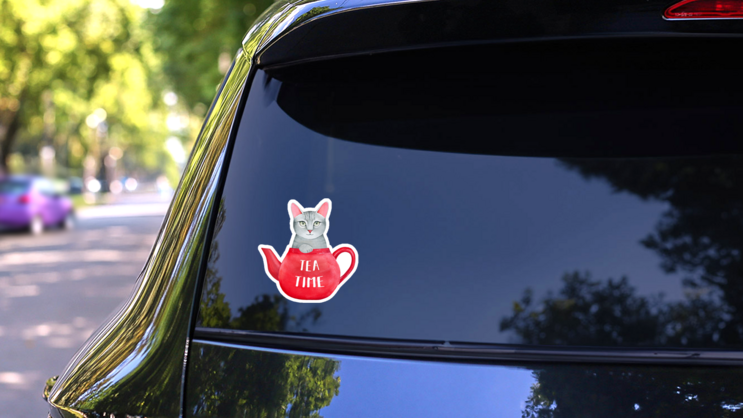 Tea Time Illustration Of Tea Pot And Kitten Sticker on a Rear Car Window (New) example