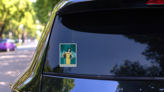 Teal Aquarius Zodiac Water Woman Sticker  on a Rear Car Window (New) example