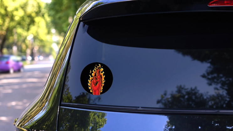 The Burning Devil Cross Fingers Sticker on a Rear Car Window (New) example