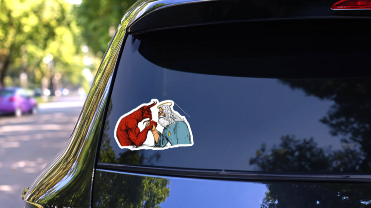 The Devil And God Arm Wrestle Sticker on a Rear Car Window (New) example
