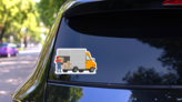 The Loader Mover Unloads The Goods From The Truck Sticker on a Rear Car Window (New) example