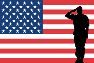The USA Flag With Silhouette Of A Saluting Soldier