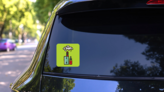 Thin Line Vape Device With Juice Sticker on a Rear Car Window (New) example