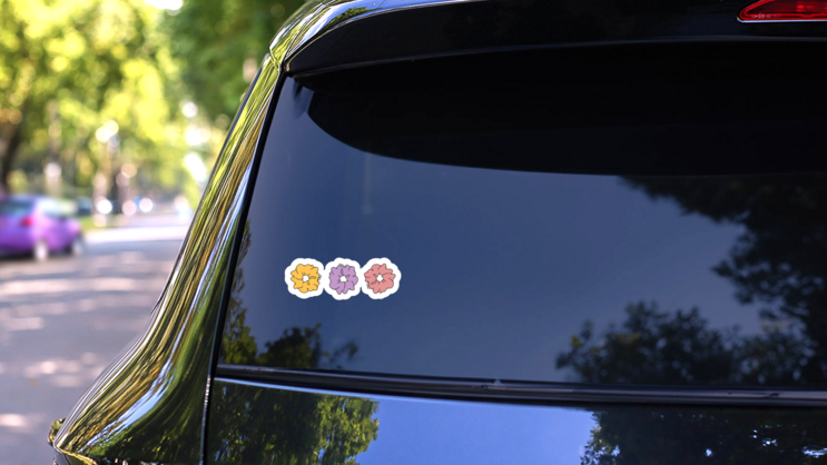 Three Cute 80s Scrunchies Sticker  on a Rear Car Window (New) example