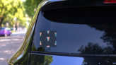 Tongue In Psychedelic Style Sticker on a Rear Car Window (New) example