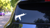 Uzi Gun Sticker on a Rear Car Window (New) example