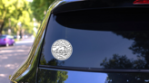 Vintage Round Label North Dakota Bison Sticker on a Rear Car Window (New) example