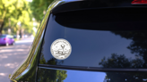 Vintage Round Label Of Pennsylvania Deer Sticker on a Rear Car Window (New) example