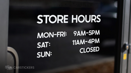 Vinyl lettering decal on storefront window with hours of operation.