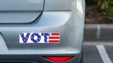 VOTE USA Themed Bumper Sticker on a Grey Car Bumper example