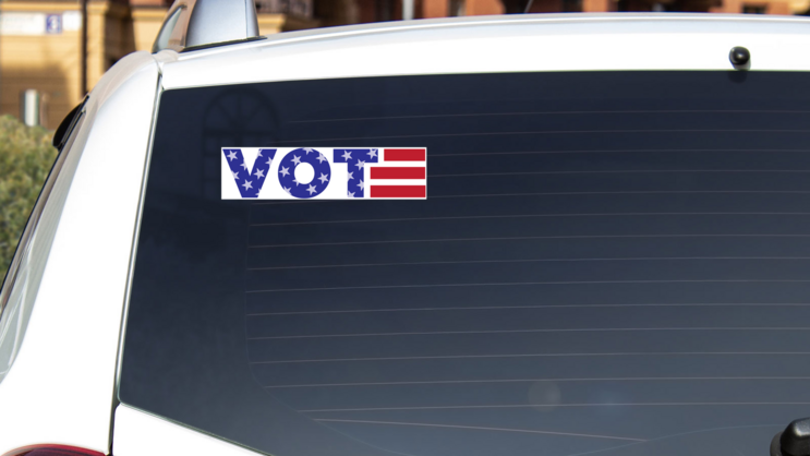 VOTE USA Themed Bumper Sticker on a White Car Rear Window example