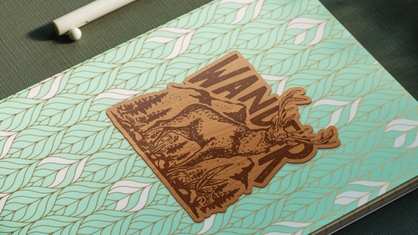 Wander wood sticker on journal