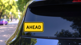 Warning Ahead Sticker on a Rear Car Window (New) example
