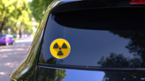Warning Radioactive Sign Danger Symbol Sticker on a Rear Car Window (New) example