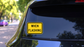 Warning When Flashing Sticker on a Rear Car Window (New) example