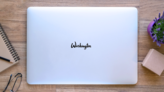 Washington Handwritten Calligraphy Sticker on a Laptop (New) example