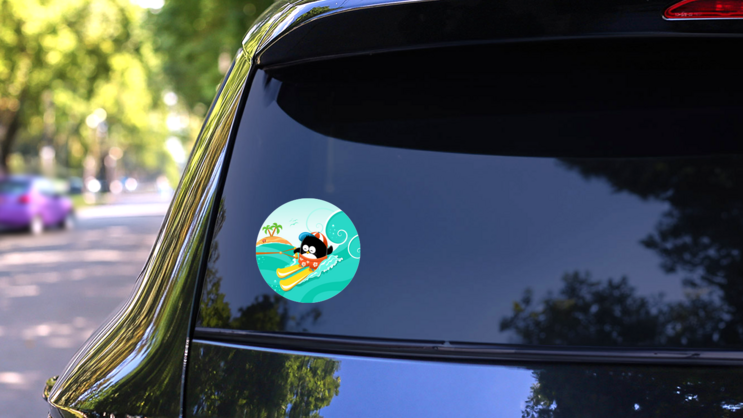 Water Skiing Penguin Illustration Sticker on a Rear Car Window (New) example