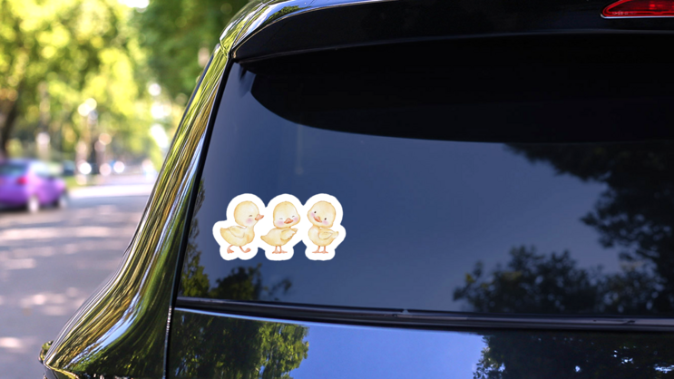Watercolor Illustration, Set Of Cute Easter Ducklings Sticker on a Rear Car Window (New) example