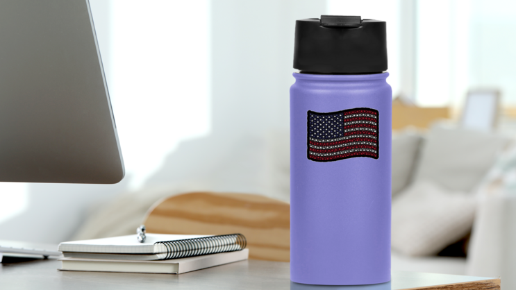 Waving American Cannabis Flag Sticker on a Water Bottle (New) example