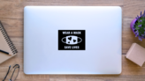 Wear a Mask Save Lives Sticker on a Laptop (New) example