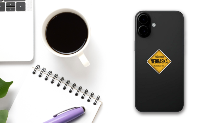 Welcome To Nebraska The Cornhusker State Yellow Sign Sticker on a Phone (New) example