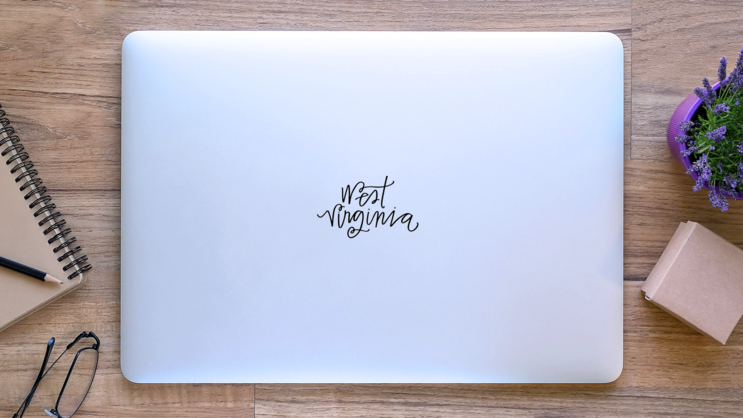 West Virginia Beautiful Lettering Sticker on a Laptop (New) example