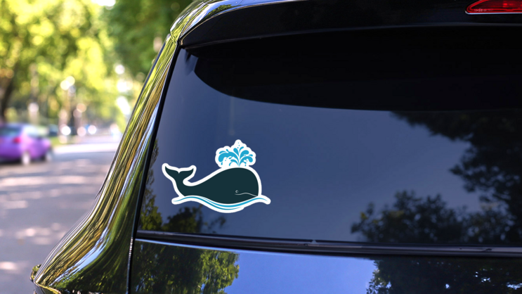 Whale Icon Blowing Water Sticker on a Rear Car Window (New) example