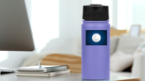 White Moon With Starry Sky Sticker on a Water Bottle (New) example