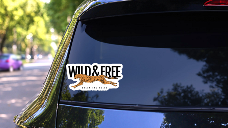Wild And Free Text With Cheetah Running Sticker on a Rear Car Window (New) example