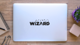 Wizard Hat And Stars Text Sticker on a Laptop (New) example