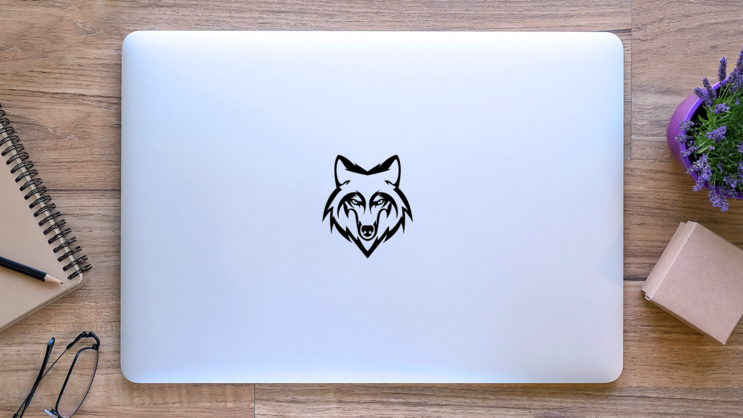 Wolf Head Staring Sticker on a Laptop (New) example