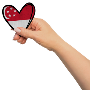 Woman Hand Is Holding Singapore Heart Sticker