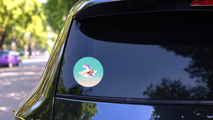 Woman On Beach In Unicorn Float Sticker on a Rear Car Window (New) example