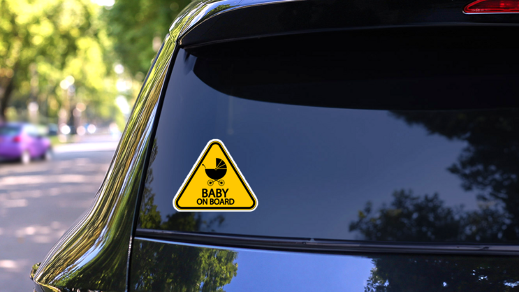 Yellow Baby on Board Sign Sticker with Stroller on a Rear Car Window (New) example